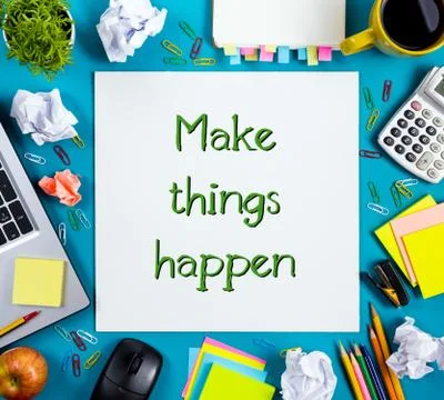 Make things happens. Office table desk with supplies, white blank note pad, cup Stock Photos