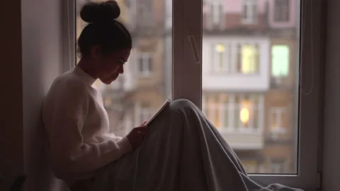 Make time for yourself. Side view of relaxed young mixed race woman with blanket Stock Footage 146203704