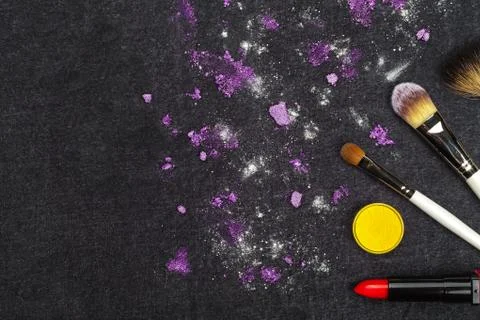 Make up tools and loose purple eyeshadow Stock Photos