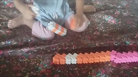 Make a tower from colorful legos Stock Footage 291003267