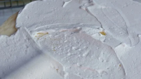 Make a whipped cream on the cake. Stock Footage 83755458