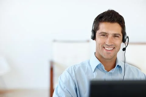 Make winning your priority. Cropped shot of a young man wearing a headset in his Stock Photos