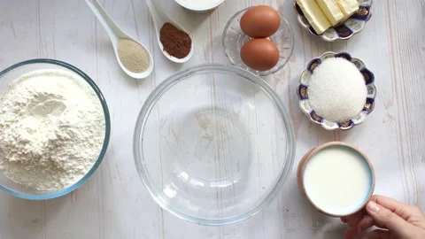 Make yeast dough for baking, add dry yeast and sugar into the bowl with milk Stock Footage 134734714