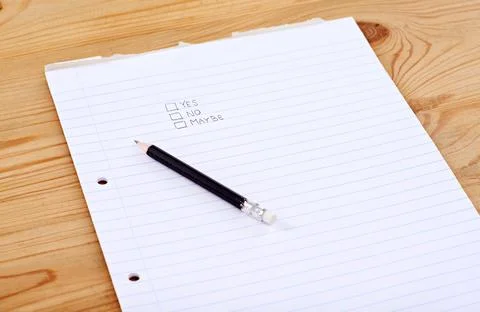Make your choice. A writing pad with the words yes, no and maybe in check boxes. Foto stock