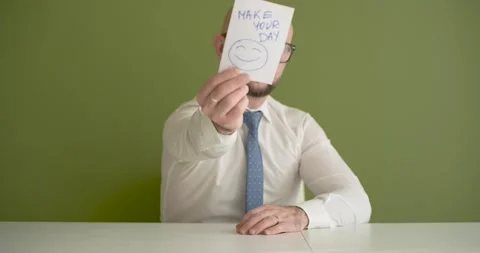 Make your Day - A man presents a note with the word Stock Footage 267088317