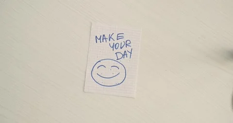 Make your day  - a man's hand presents a word on the note Stock Footage 267086965