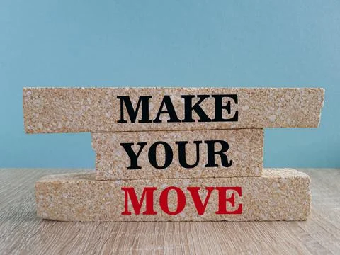 Make your move symbol. Brick blocks with red words Make your move. Stock Photos