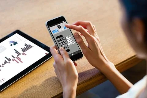 Make your own app smartphone against businesswoman using a smartphone 写真素材