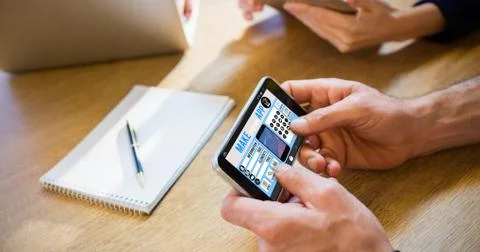 Make your own app smartphone against colleagues using technology 写真素材