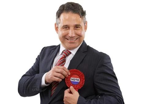 Make your vote count. Portrait of a man in a suit with a voting ribbon on a Stock Photos