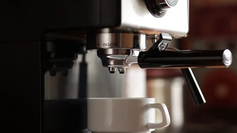 Maker pouring coffee in a cup Stock Footage 127511433