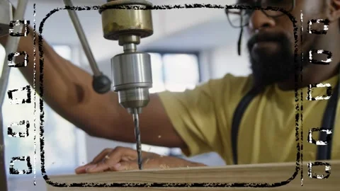Maker pulling drill lever, drilling board while steadying hands, reaching depth, Stock Footage 335235283