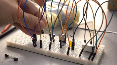 Maker, student or electronics engineer developing prototype electronics circu Stock Footage 100512252