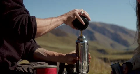 Makes coffee picnic in the mountains Stock Footage 232138662