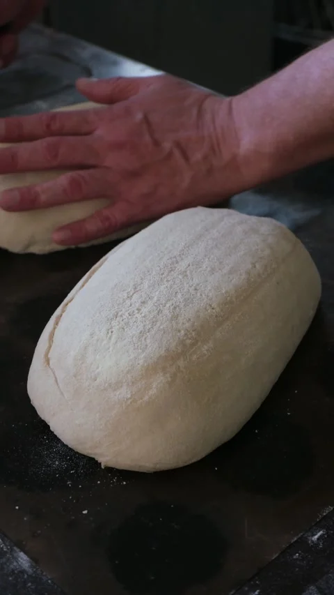 Makes cuts on bread with a blade Stockbeeldmateriaal 341265358