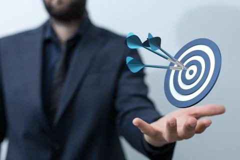 A  makes a dart throw on the target. The concept of persistence in business.. Stock Photos