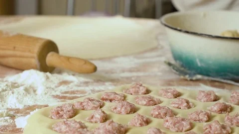 Makes the dough flat with rolling pin on the table Video stock 80043788