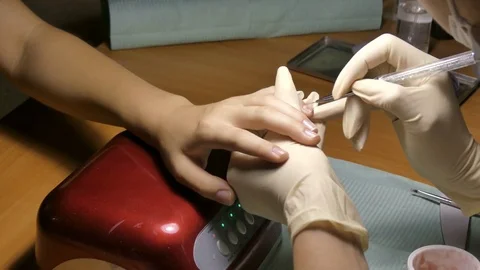 The makes manicure gel lacquer Video stock 79326657