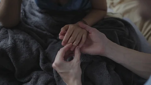 Makes a proposal to his girlfriend in bed, and she agrees. Stock Footage 103150600