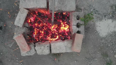 Makeshift barbecue made bricks. Preparation coals in grill, cooking shish kebab Stock Footage 144249841
