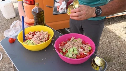Makeshift salad being prepared outside 스톡 동영상 100802853