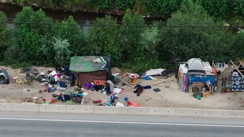 Makeshift tents along a highway Stock Footage 345047842