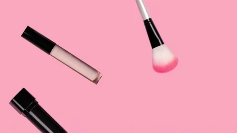 Makeup accessories fly on pink background. Beauty animation. Cosmetic products. Stock Footage 159902768