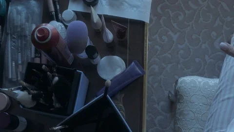 Makeup accessories jars brushes creams everything lies on the table Stock Footage 124247281