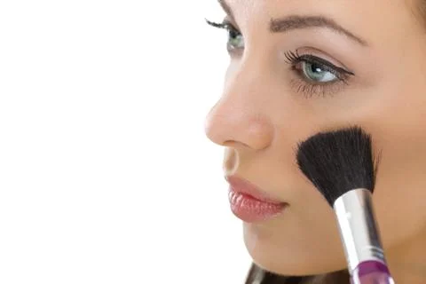 Makeup. Applying Make-up Cosmetics Brush Foto stock