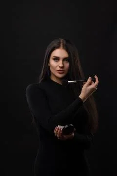 Makeup. Applying Make-up Cosmetics Brush. Perfect Make-up. Stock Photos