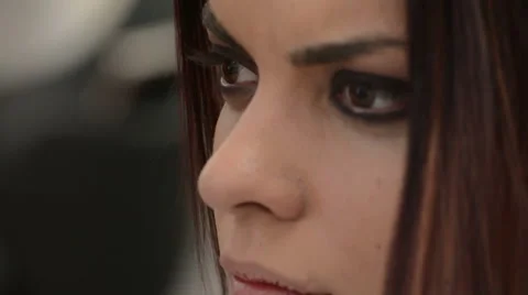 Makeup artist adjusting makeup on models face Stock Footage 43978236