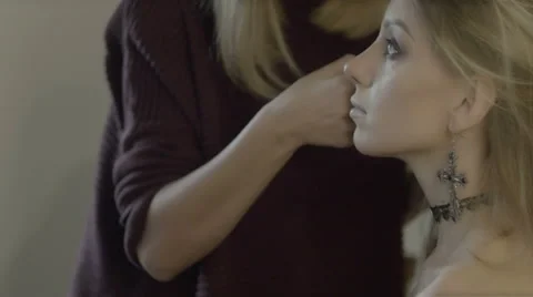 Makeup artist applies eye shadow. Beautiful woman face. Perfect makeup Stock Footage 67962641