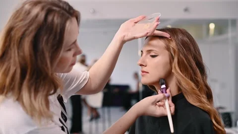 Makeup artist applies foundation. Stock Footage 257205409