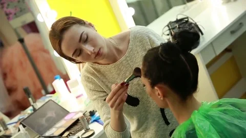 Makeup artist applies makeup Stock Footage 74350216