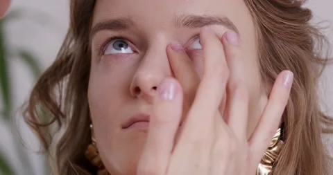 Makeup Artist Applies Makeup to the Young Model. Stock Footage 164490366
