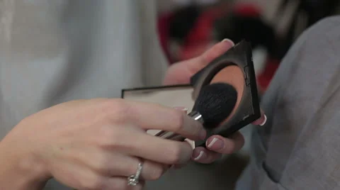 Makeup artist apply blush, making professional makeup for a woman Stock Footage 45791507