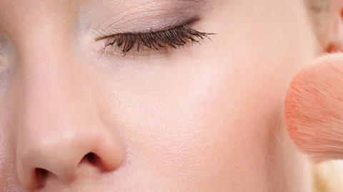 Makeup artist applying blush with brush. Stock Footage 115805513
