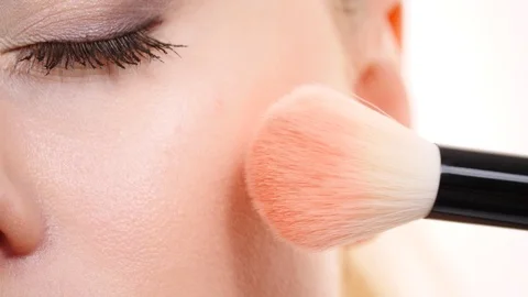 Makeup artist applying blush with brush. Stock Footage 115805528