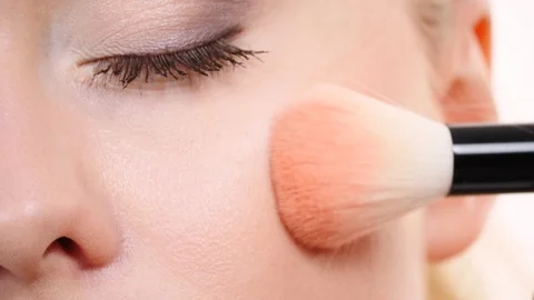 Makeup artist applying blush with brush. Stock Footage 115805581