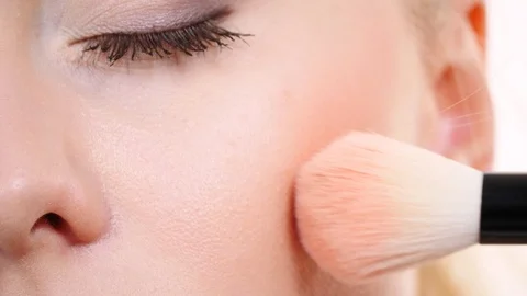 Makeup artist applying blush with brush. Stock Footage 115805677