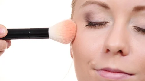 Makeup artist applying blush with brush. Stock Footage 115806763