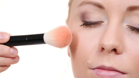 Makeup artist applying blush with brush. Stock Footage 115806793