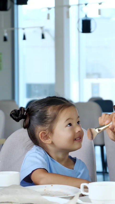 Makeup artist applying blush to cute asian girls face Stock Footage 341191555