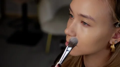 Makeup Artist Applying Concealer on Model Stock Footage 263838797