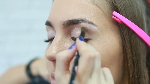 Makeup artist applying eyeshadow. Stock Footage 81572163
