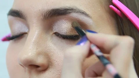 Makeup artist applying eyeshadow. Stock Footage 81572169