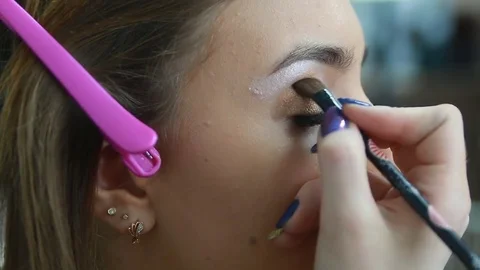 Makeup artist applying eyeshadow. Stock Footage 81572212