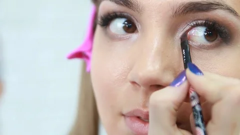 Makeup artist applying eyeshadow. Stock Footage 81572477
