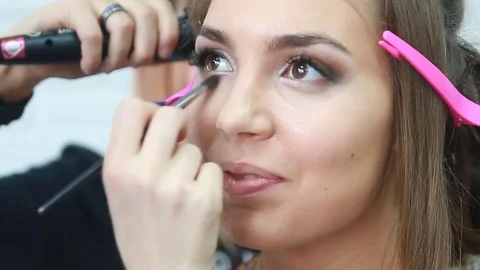Makeup artist applying eyeshadow. Stock Footage 81572484