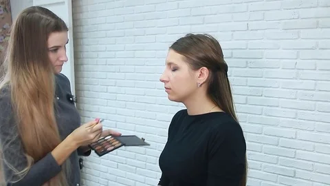 Makeup artist applying eyeshadow. Stock Footage 81942876